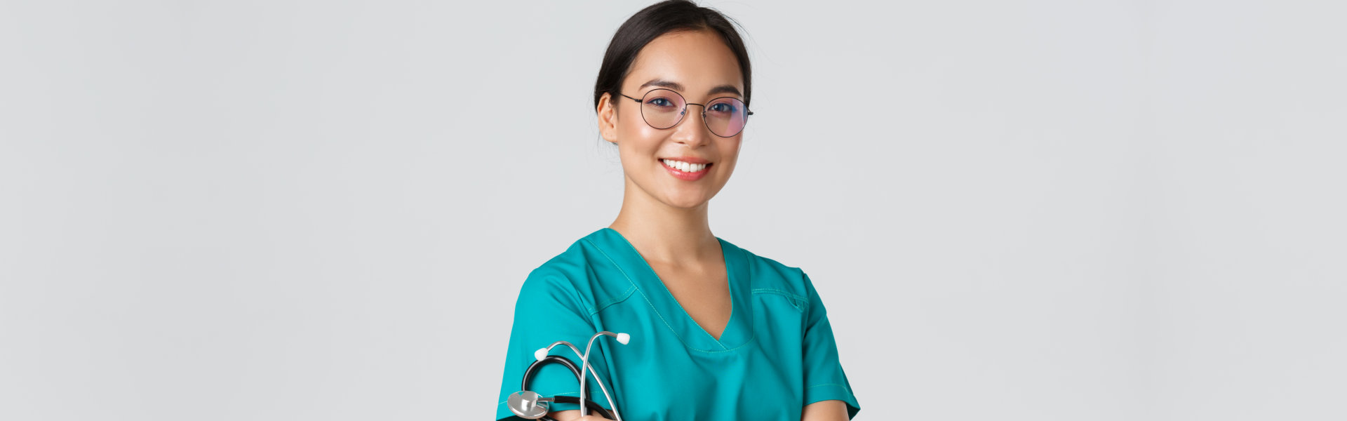 medical worker in glasses and scrubs