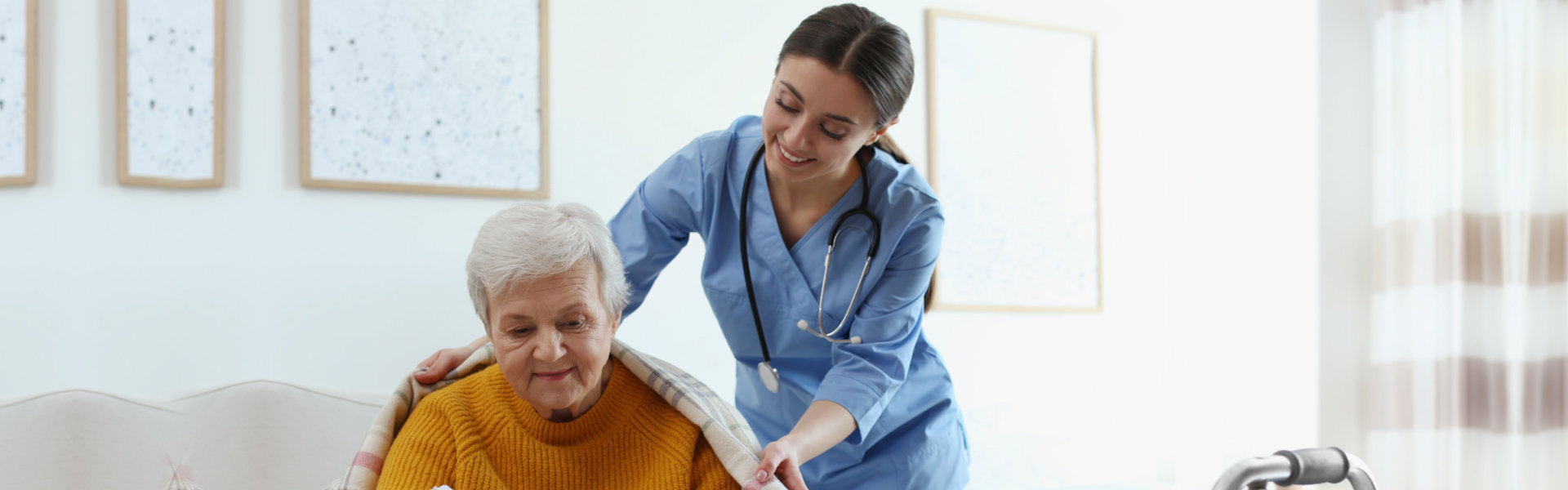 doctor is helping the senior woman